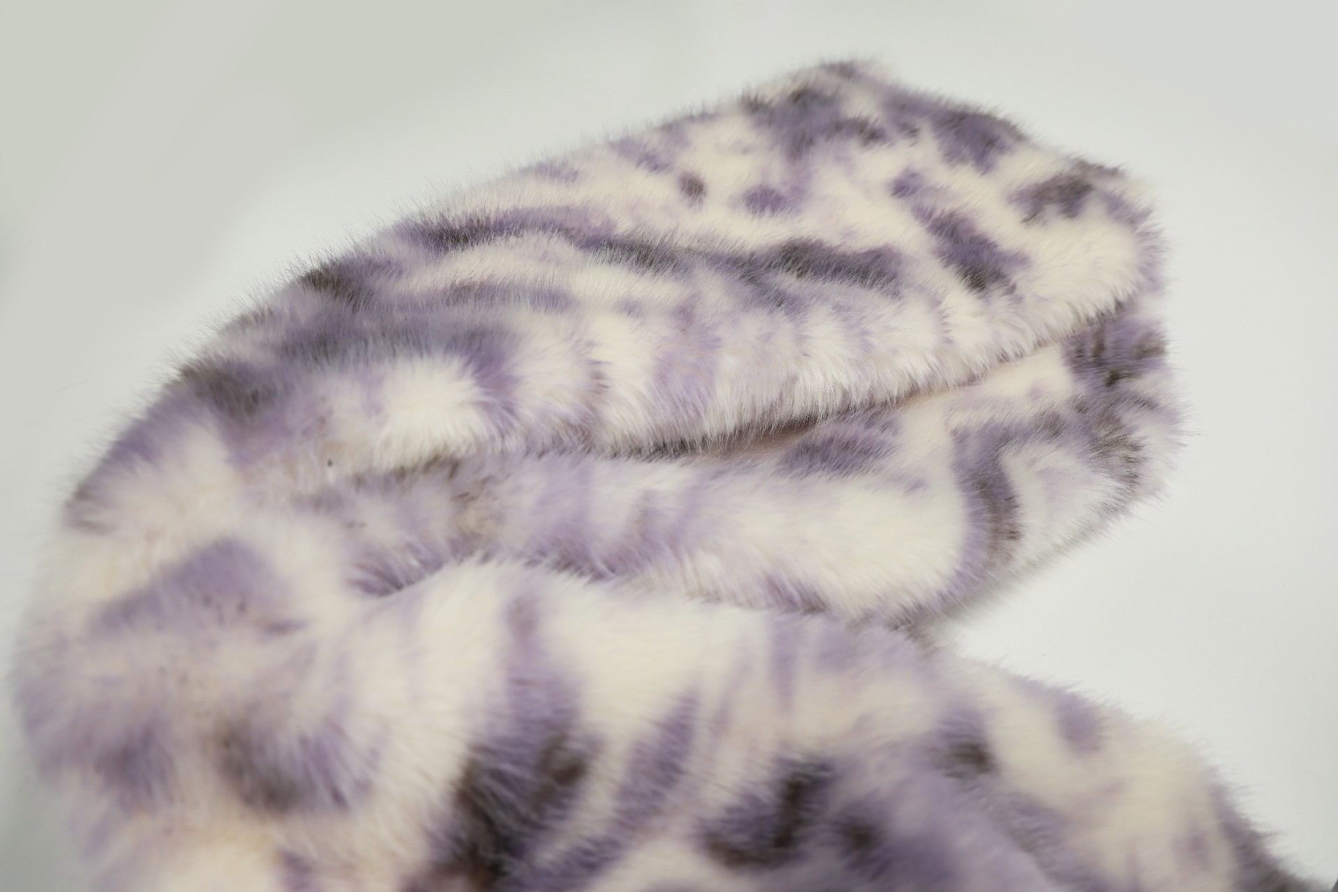 faux fox fur fabric with purple phoenix pattern