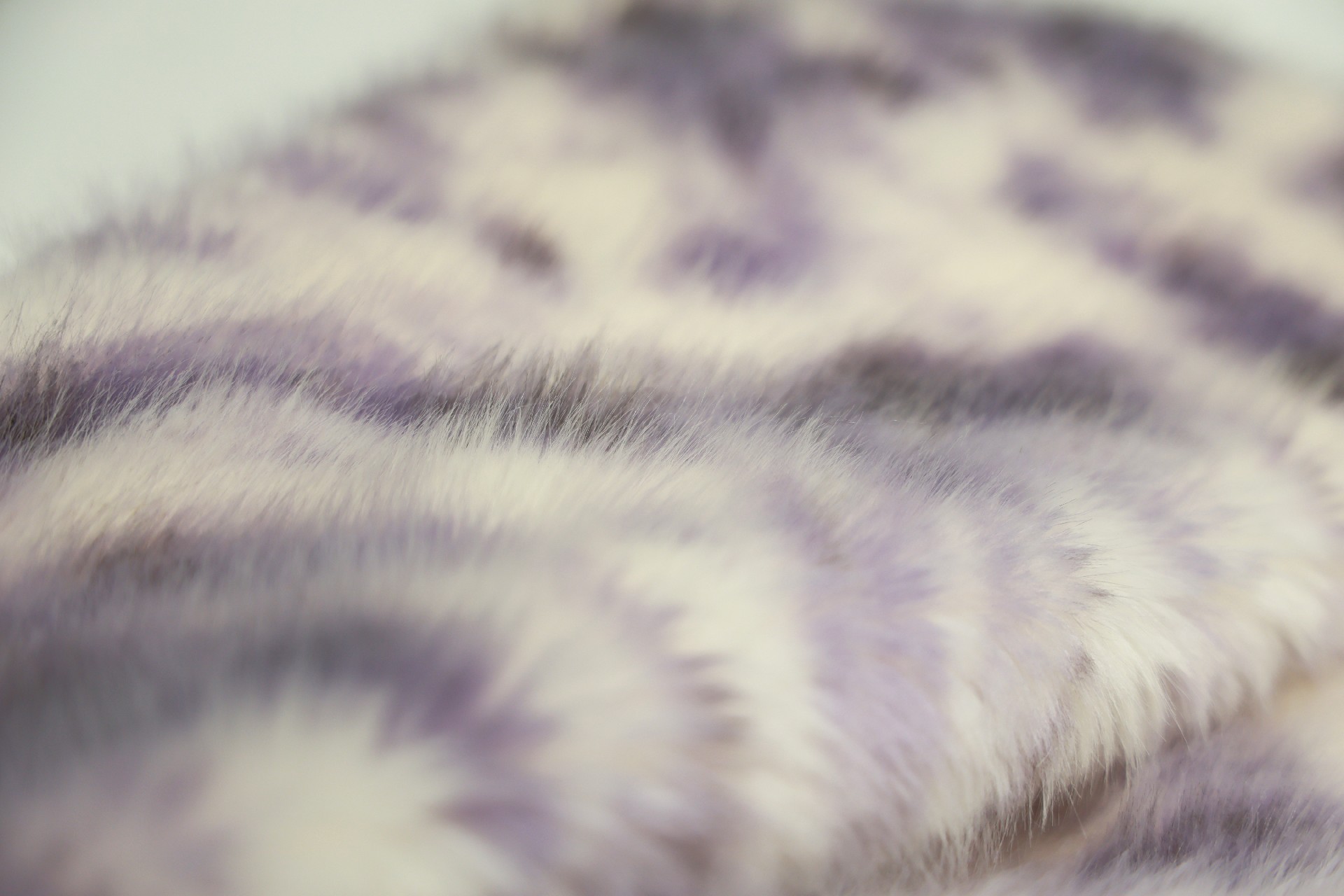 faux fox fur fabric with purple phoenix pattern