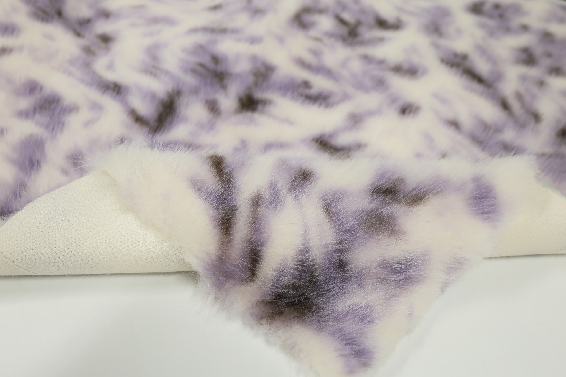 faux fox fur fabric with purple phoenix pattern