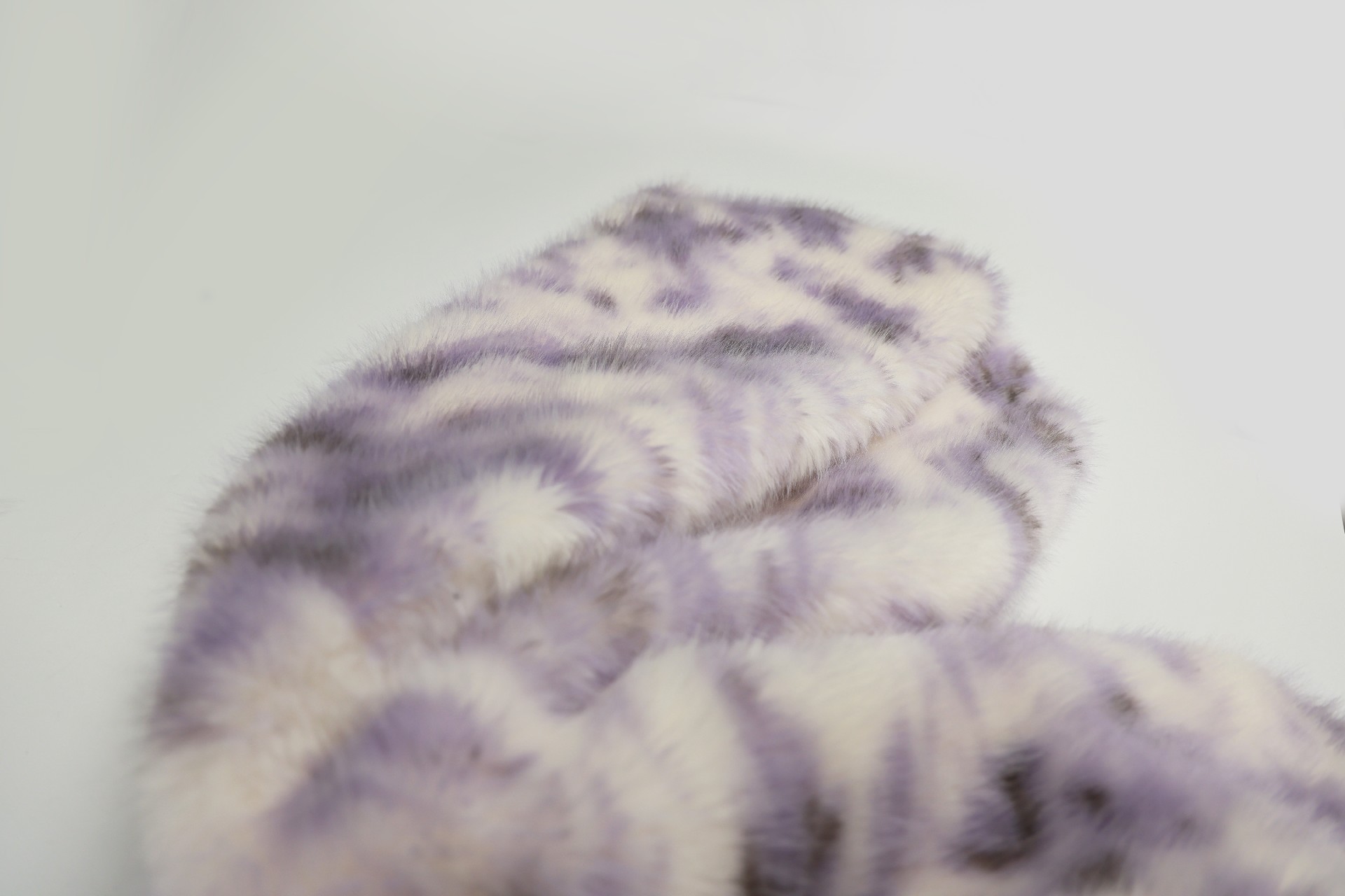 faux fox fur fabric with purple phoenix pattern